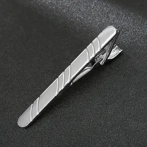 Silver metal tie clip close up, elegant business suit accessory for men's formal wear.