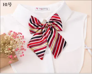 Detailed view of the striped bow tie collar accessory, showing colorful fabric and neat stitching.