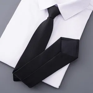 Classic black men business tie paired with white dress shirt detail shot for professional look.