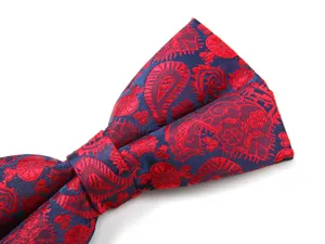 Men's formal bow tie in blue with red paisley pattern, elegant wedding suit accessory.