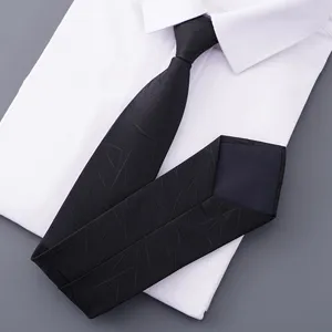 Close-up view of an elegant black textured business necktie displayed on a clean white shirt.