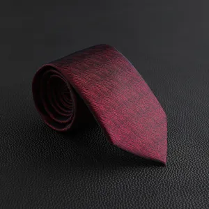 Luxury dark red textured men's necktie detail shot, perfect for business formal wear and weddings.
