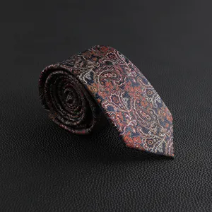 Close-up of vintage paisley patterned men's necktie detail with intricate woven designs.