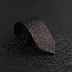 Detailed view of a men's vintage patterned business formal necktie in dark brown textured fabric.