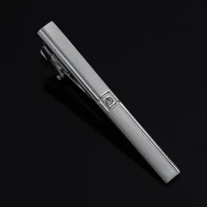 Silver tie clip detail showcasing sleek metallic finish and sparkling crystal inlay for business wear.