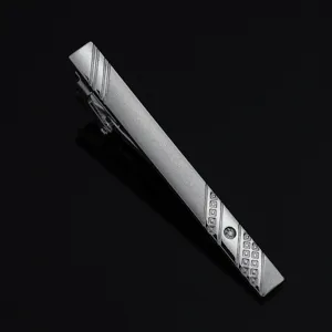 Detailed closeup of mens silver tie clip, featuring frosted finish, diagonal stripes and crystal.