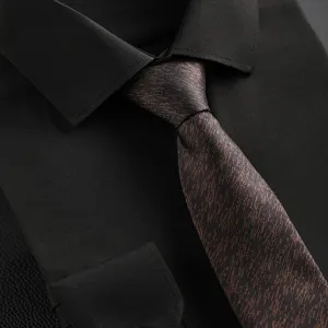 Men's classic black dress shirt paired with a stylish textured striped tie detail closeup shot.