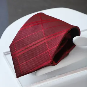 Wine red grid necktie detail shot, premium formal business tie for men wedding suit.