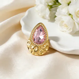 Elegant teardrop pink zircon brooch with 18k gold tone titanium steel and hammered base.