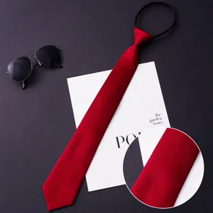 Red zipper tie detail close-up showing fine twill texture and convenient design for men.