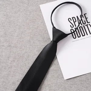 Detail view of the black men's zipper necktie, featuring a fine twill woven texture.