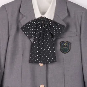 Grey JK uniform blazer featuring a white shirt collar and a cute black polka dot bow tie accessory.