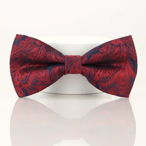 Exquisite red and dark blue paisley bow tie detail view, elegant wedding groom accessory.
