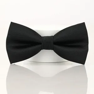 Black bow tie detail showcasing fine textured fabric and clean bow shape design.