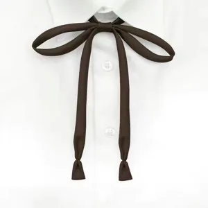 Close-up detail of dark brown ribbon tie for JK uniform, neat and stylish accessory.