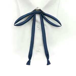 Detail view of a dark blue satin JK uniform ribbon tie showcasing smooth texture and knot.