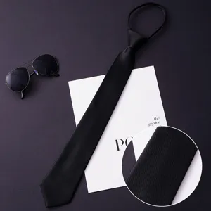 Men's black business zipper necktie detail showing fine twill fabric texture and design.
