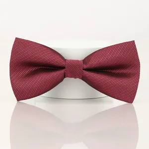 Detail view of a burgundy striped bow tie for men, wedding and formal wear accessory.
