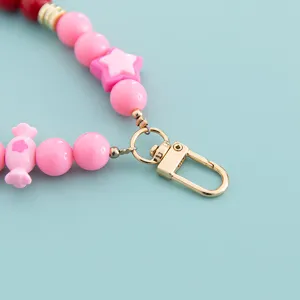 Candy color beaded phone charm strap accessory with cute star and candy design, detail view.