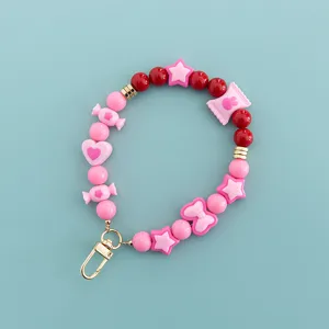 Sweet candy color beaded phone charm strap detail showing cute star and heart charms.