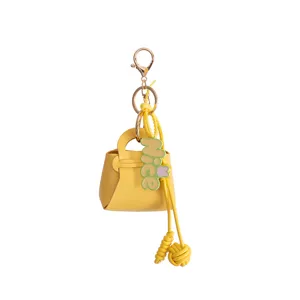 Mini yellow leather handbag keychain with metal ring cute bag charm pendant for women.