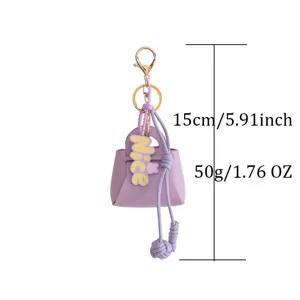 Purple PU leather miniature handbag keychain featuring golden clasp and lovely nice charm accessory.