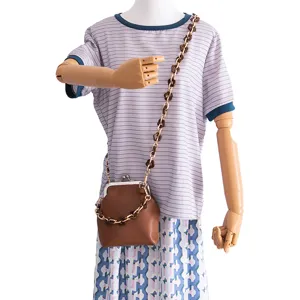 Brown kiss-lock handbag with stylish acrylic flower chain strap, perfect for DIY fashion look.