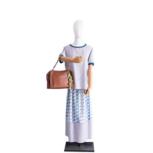 Green tassel keychain bag charm with brown PU leather handbag for stylish daily accessory decoration.