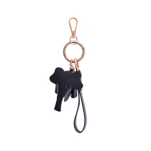Porte-clés éléphant en cuir noir avec accessoires dorés, charm mignon pour clés et sacs.