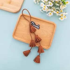 Brown PU leather tassel keychain and cute bag charm with personalized name tag.