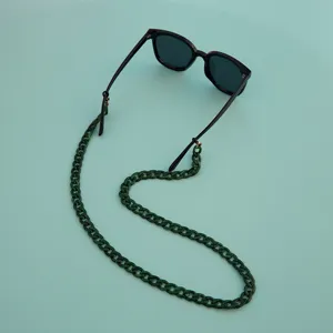 Green acrylic chunky glasses chain detail view, stylish eyewear strap accessory, close-up shot.