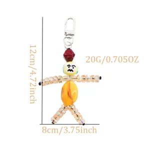 Handmade beaded doll keychain detail shot, quirky cute backpack charm, 12cm size, lightweight design.