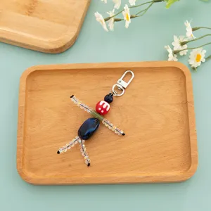 Handmade beaded doll keychain, cute quirky bag charm and car key accessory for gifts.