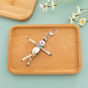 Hand-painted beaded doll keychain cute quirky bag pendant trendy couple gift accessory.