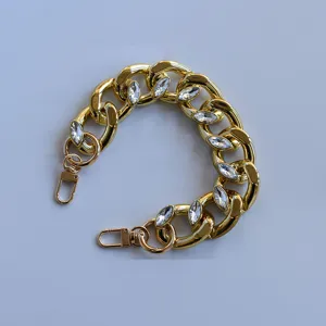Chunky Cuban chain bag strap with sparkling marquise rhinestones and metal lobster clasps.