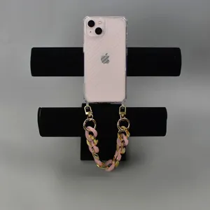Acrylic chunky phone chain strap in pink and gold for women stylish bag strap accessory.
