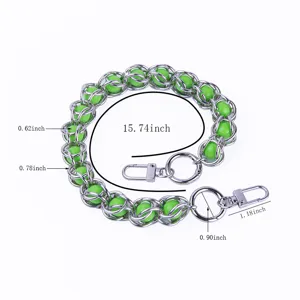 Metal bead bag chain and phone strap detail, silver chain with green acrylic beads for accessories.