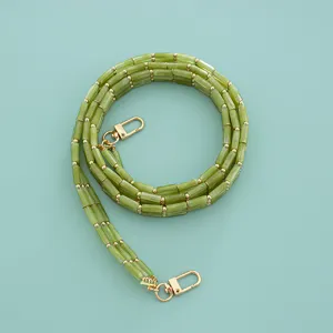 Green acrylic bamboo style bag strap with gold metal clasps for cross body handbags replacement.