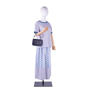 Detailed view of the stylish handbag chain and matching bag on a mannequin display.