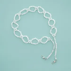 White beaded bag strap and phone chain, woven pearl bead design with metal clasps.