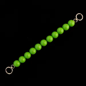 Green beaded purse strap replacement with gold spring rings, chic bag handle accessory.