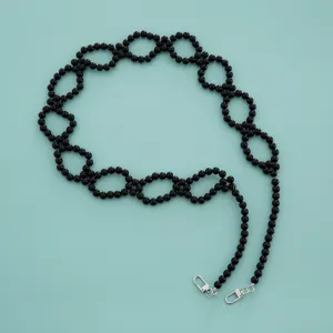 Stylish black beaded bag strap with metal clasps, perfect for handbags, phones or masks.