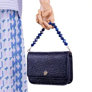 Black embossed floral handbag with blue geometric acrylic bead chain, stylish and elegant daily use bag.