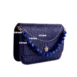 Dark blue embossed women handbag with blue acrylic beaded chain, detail view of bag size.