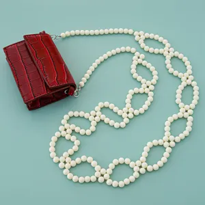 Red crocodile pattern mini bag with long white pearl beaded strap main view product display