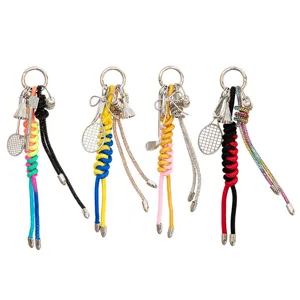 Detailed view of alloy sports pendant showcasing delicate rackets, bows, and colorful woven ropes.
