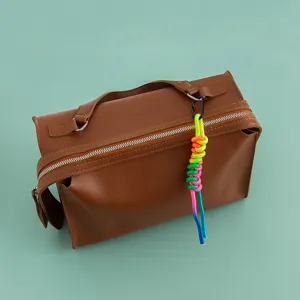 Colorful braided rope bag charm with carabiner, perfect stylish accessory for women's handbags.