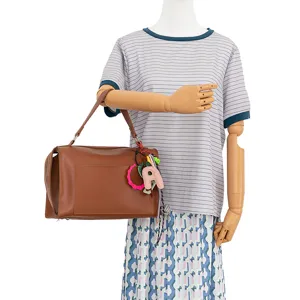 Brown leather shoulder bag with chic letter charms, minimalist style everyday handbag.