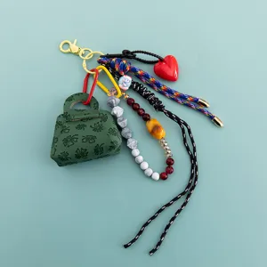 Portachiavi borsa mini in pelle PU perline di cristallo corda intrecciata ciondolo