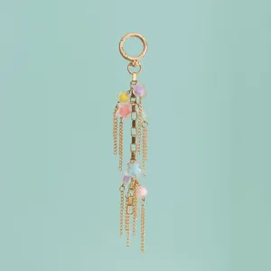 Detail view of the colorful macaron resin star and chain charm for bags and keys.